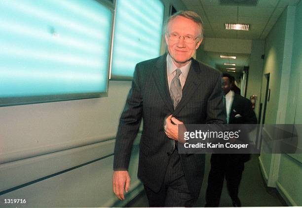 Senate Minority Whip Harry Reid leaves CBS studios December 17, 2000 following his appearance on the CBS talk show "Face the Nation" in Washington,...