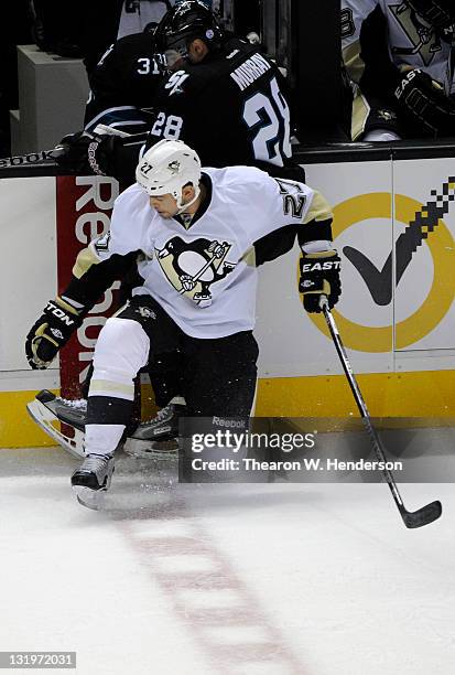 Craig Adams of the Pittsburgh Penguins collides with Andrew Murray of the San Jose Sharks at HP Pavilion at San Jose on November 3, 2011 in San Jose,...