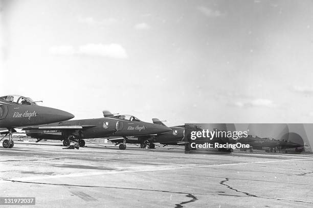 The Grumman F11F-1 “Tigers” of the United States Navy’s Blue Angels precision flying team sits on the tarmac of an airport prior to a performance....