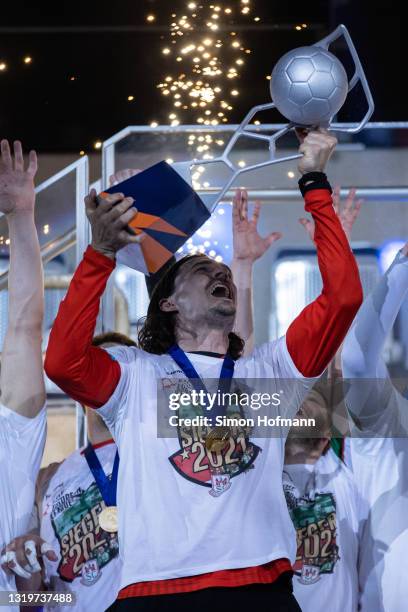 Jannik Green of Magdeburg celebrates with the trophy after the EHF European League Final match between SC Magdeburg and Fuechse Berlin at SAP Arena...