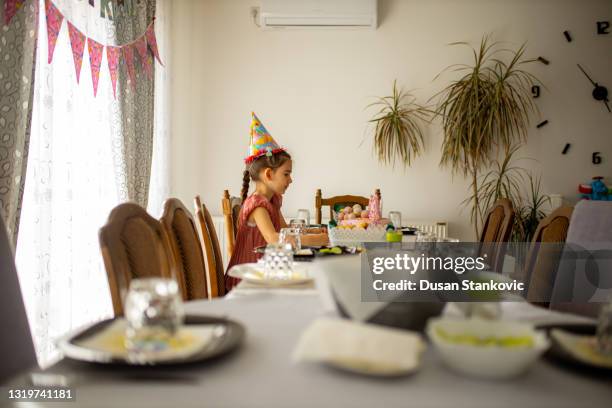 little girl looking at the birthday cake - pre-birthday stock pictures, royalty-free photos & images
