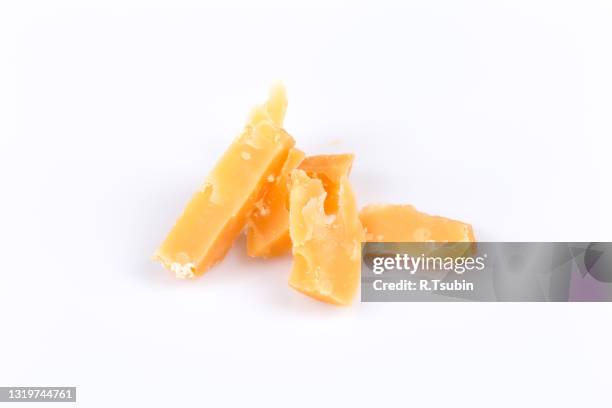 piece of old cheese on a napkin, studio shot. - grated cheese stock pictures, royalty-free photos & images