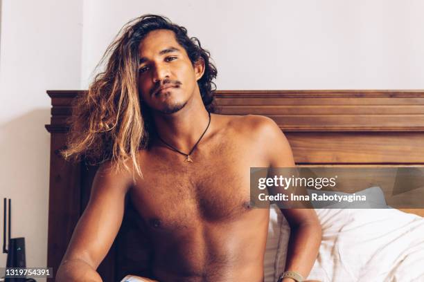 sri lankan young man's portrait - asian man long hair stock pictures, royalty-free photos & images