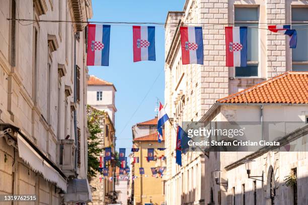 croatian flags on zadar streets - croatia flag stockfoto's en -beelden