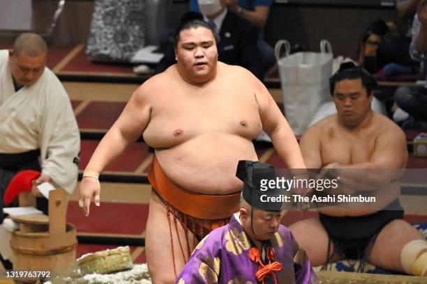 Komusubi Mitakeumi reacts after his victory over Onosho during day thirteen of the Grand Sumo Summer Tournament at Ryogoku Kokugikan on May 21, 2021...