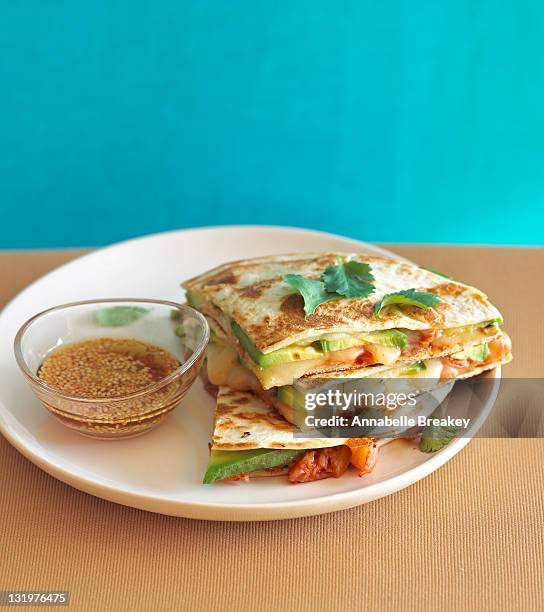 avocado quesadillas on a plate - quesadilla stock pictures, royalty-free photos & images