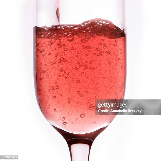 pink sparkling rose wine poured into wine glass - annabelle rose imagens e fotografias de stock