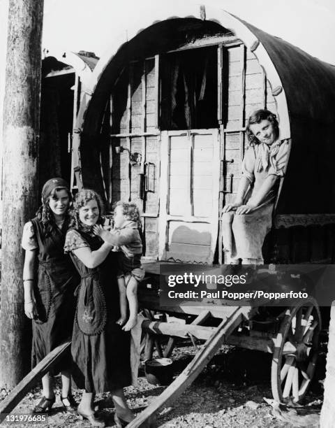 Group of gypsies with a caravan in Ireland, circa 1950.