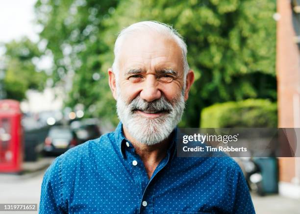 man looking at camera, smiling - true peoples celebration day one stock pictures, royalty-free photos & images