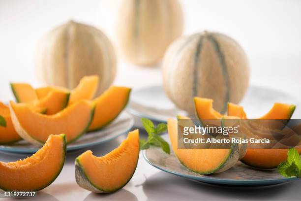 cantaloup melon slices for dessert - melon stock pictures, royalty-free photos & images