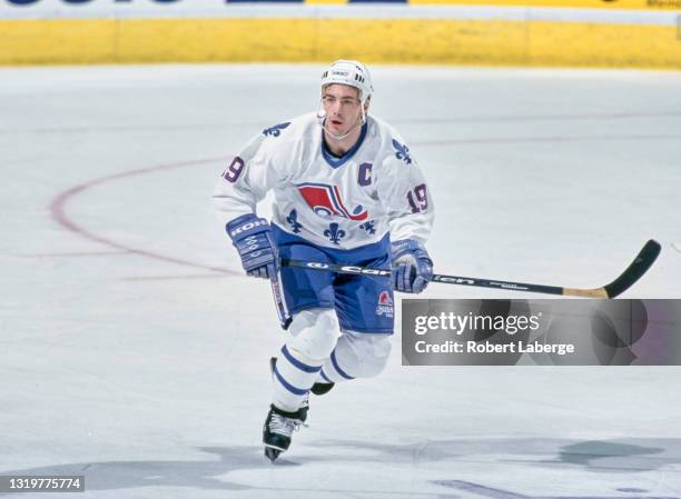 Joe Sakic, Captain and Center for the Quebec Nordiques in motion on the ice during the NHL Eastern Conference Northeast Division game against the...