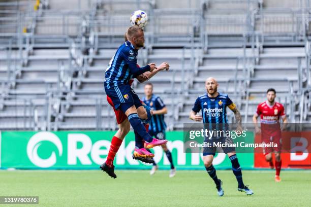 Nicklas Barkroth of Djurgardens IF in an arial duel during the Allsvenskan match between Djurgardens IF and IFK Goteborg at Tele2 Arena on May 23,...