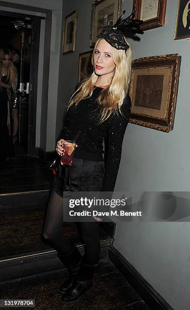 Poppy Delevingne attends the Alice + Olivia Black Tie Carnival hosted by designer Stacey Bendet at Paradise by Way of Kensal Green on November 9,...