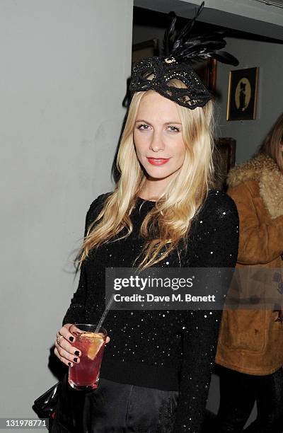 Poppy Delevingne attends the Alice + Olivia Black Tie Carnival hosted by designer Stacey Bendet at Paradise by Way of Kensal Green on November 9,...