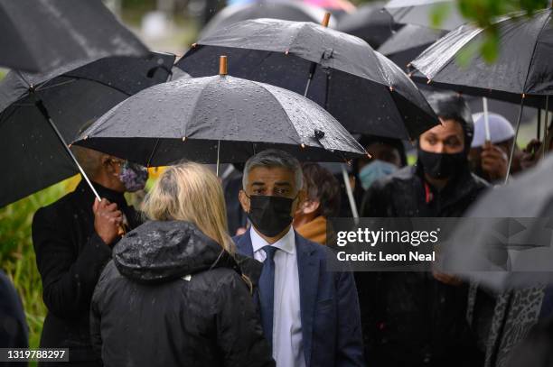 Mayor of London Sadiq Khan speaks to a guest following the opening ceremony for the London Blossom Garden at Queen Elizabeth Olympic Park on May 24,...