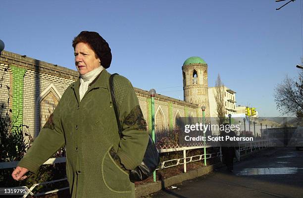 Woman walks in a park in November 2000 in Osh, Kyrgyzstan at the crossroads of the ancient Silk Road. The city of Osh in the Fergana Valley is an...