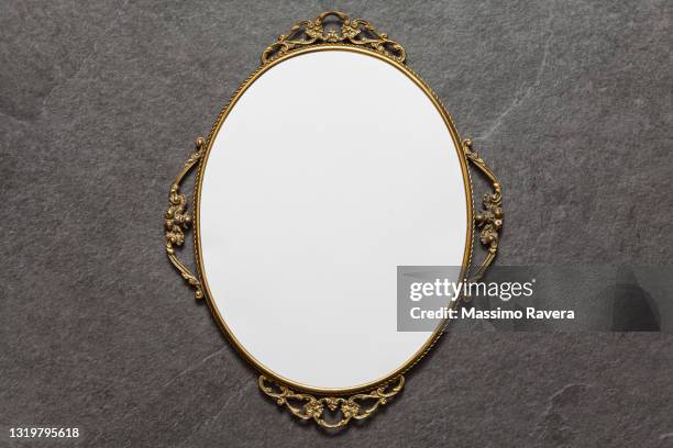 golden oval frame on stone background - royalty free space images stockfoto's en -beelden