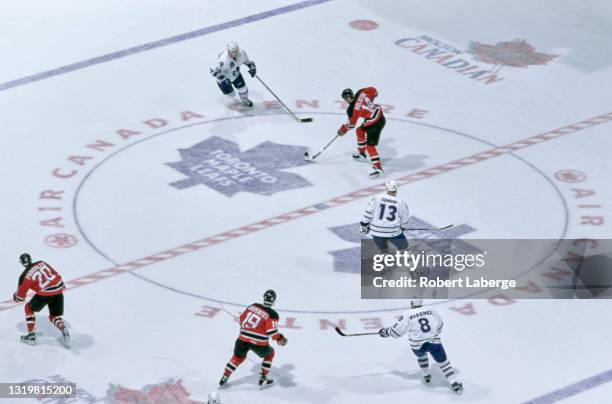 Brian Rolston#10, Center for the New Jersey Devils skates towards Bryan Berard, Defenseman for the Toronto Maple Leafs during their NHL Eastern...