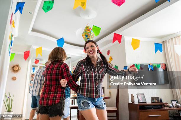 mother and daughter dancing at festa junina - hispanic month stock pictures, royalty-free photos & images