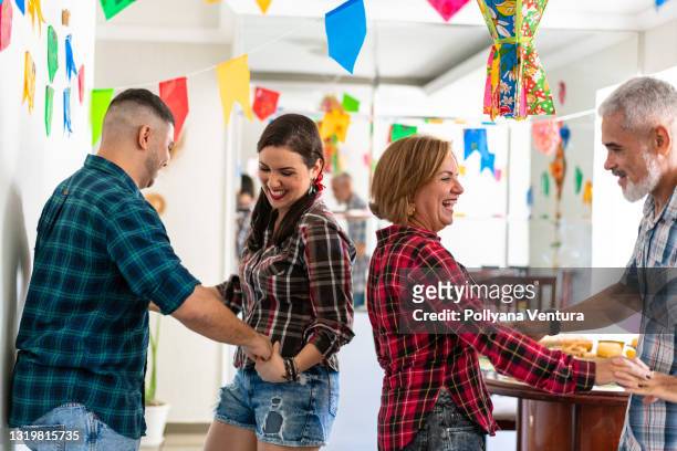 family dancing at the festa junina - square dancing stock pictures, royalty-free photos & images