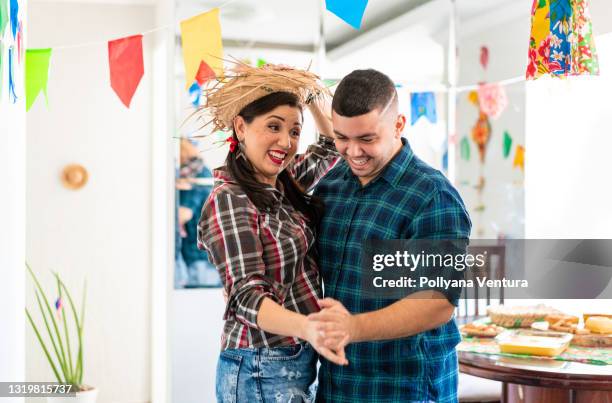 siblings dancing at festa junina - square dancing stock pictures, royalty-free photos & images