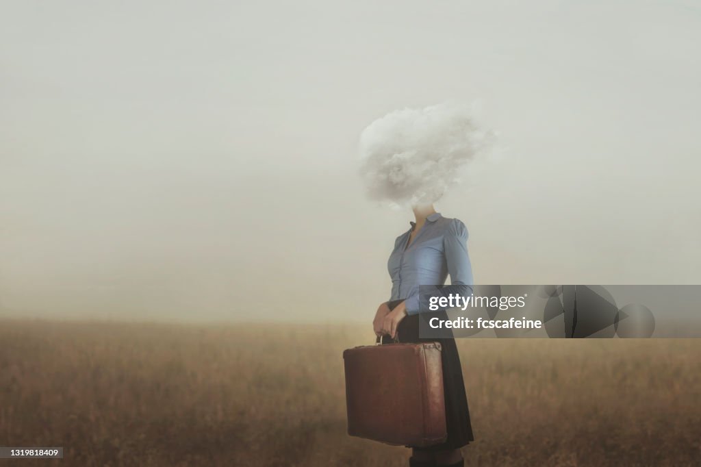 Surreal moment of a woman traveler with her head covered by a cloud