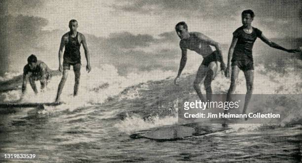 Postcard shows four men riding a wave side by side at Waikiki, "Hawaii's Famous Beach," circa 1925.