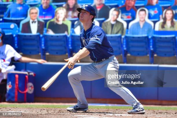 Joey Wendle of the Tampa Bay Rays hits a grand slam off of Trent Thornton of the Toronto Blue Jays in the first inning at Tropicana Field on May 24,...
