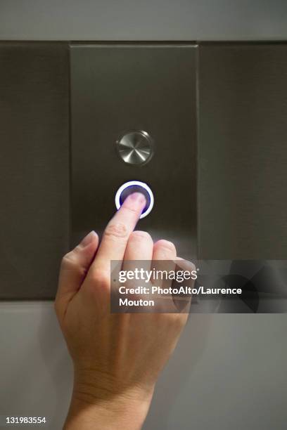 woman's finger pushing elevator's down button - pressing elevator button stock pictures, royalty-free photos & images