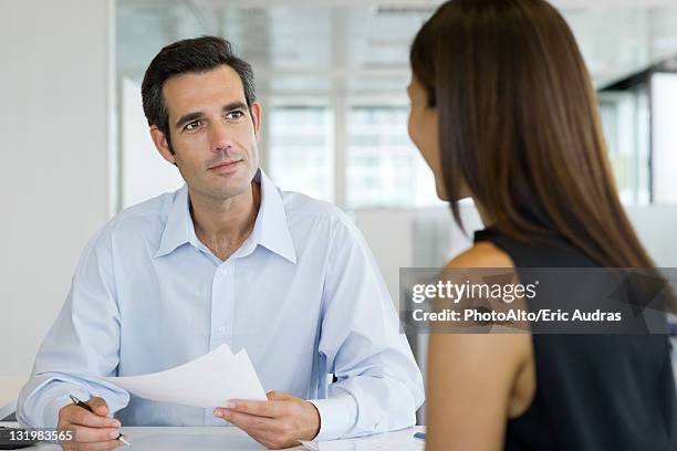 businessman conducting job interview - bankberater stock-fotos und bilder