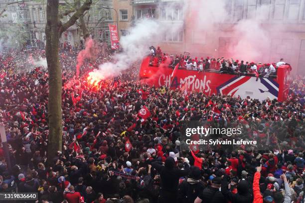 Team of Lille OSC celebrates with fans their League 1 championship trophy during a parade with the fans in a bus in down town on May 24, 2021 in...