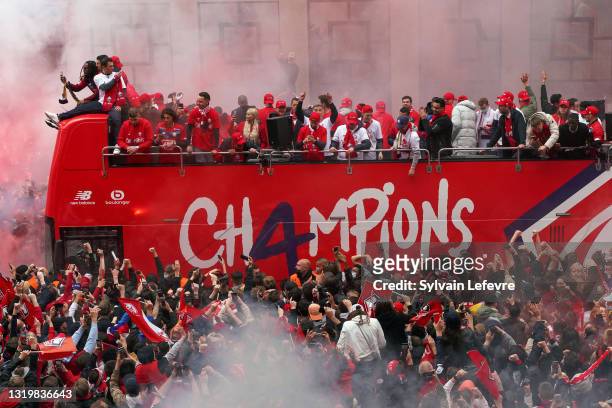 Team of Lille OSC celebrates with fans their League 1 championship trophy during a parade with the fans in a bus in down town on May 24, 2021 in...