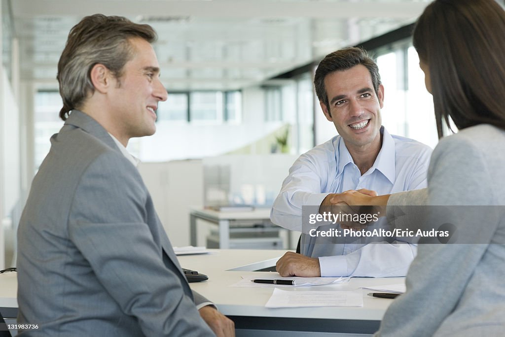 Businessman shaking hands with client