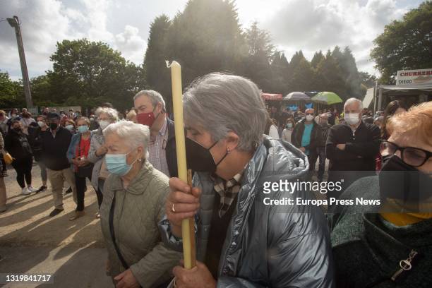 People gather outside the church during the pilgrimage of the Virgen de los Milagros de Saavedra on May 24, 2021 in Begonte, Lugo, Galicia, Spain....