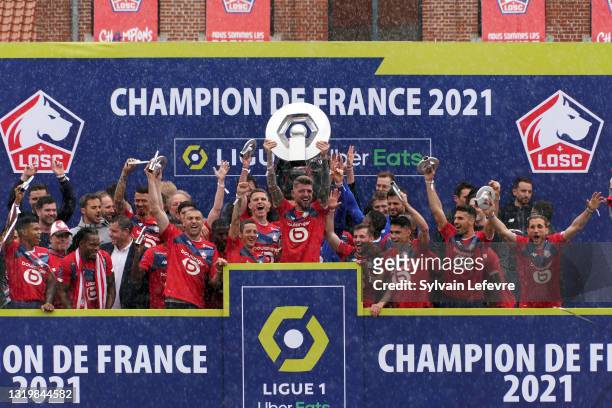 Xeka and players of Lille OSC celebrate their League 1 championship by receiving the Champions Trophy at training center of Luchin near Lille on May...
