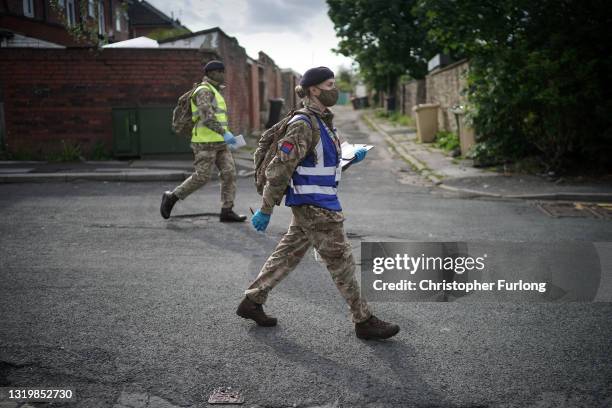 Gunners from the Royal Horse Artillery distribute Covid-19 polymerase chain reaction tests to local residents on May 24, 2021 in Bolton, England. The...