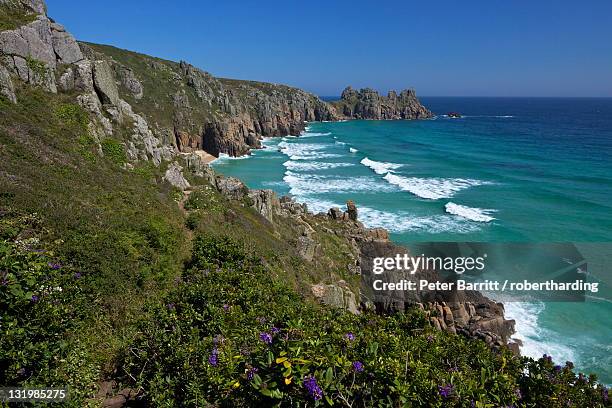 surf and turquoise sea at pednvounder beach in summer sunshine, treen cliff, near porthcurno, lands end peninsula, west penwith, cornwall, england, united kingdom, europe - penwith peninsula stock pictures, royalty-free photos & images