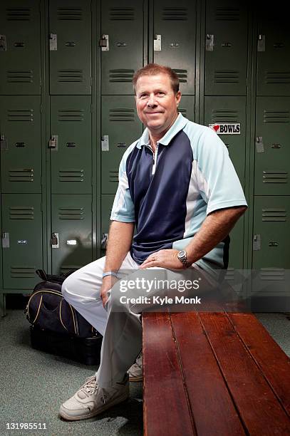 caucasian man sitting on bench in locker room - mens changing room stock pictures, royalty-free photos & images