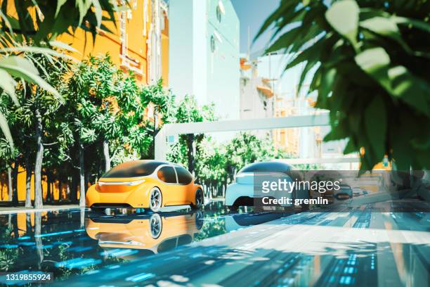 futuristic green city with generic autonomous electric cars - self driving car stock pictures, royalty-free photos & images