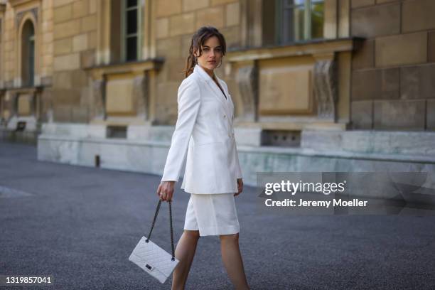 Cleo zu Oettingen-Spielberg wearing white Brunello Cucinelli blazer and shorts via Lodenfrey SS21 and white Chanel bag on May 10, 2021 in Munich,...