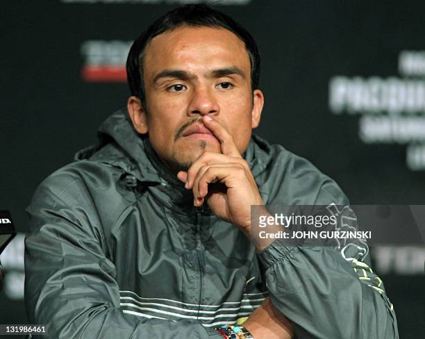 Boxer Juan Manuel Marquez of Mexico listens as he is introduced at the MGM Grand Hollywood Theatre during a final press conference with Welterweight...