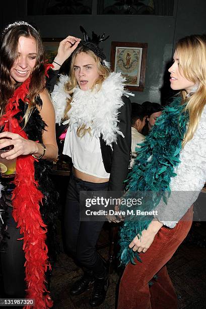 Alice Brinkley, Cara Delevingne and Mary Charteris attend the Alice + Olivia Black Tie Carnival hosted by designer Stacey Bendet at Paradise by Way...