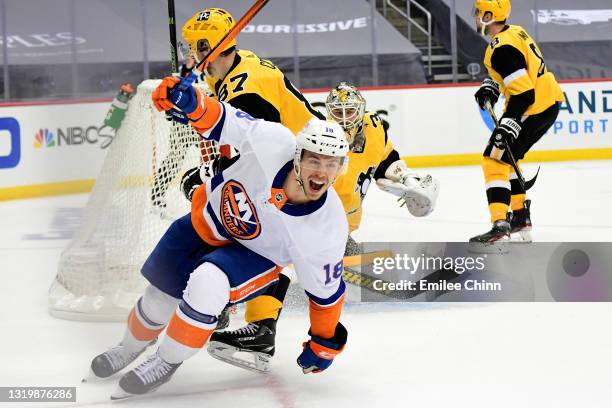 Anthony Beauvillier of the New York Islanders celebrates his goal against goaltender Tristan Jarry of the Pittsburgh Penguins during the first period...