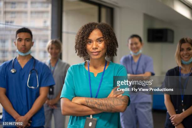group shot of healthcare and medical team - nursing scrubs stock pictures, royalty-free photos & images