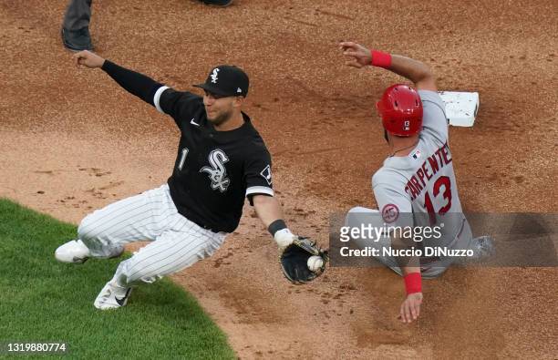 Matt Carpenter of the St. Louis Cardinals steals second base against Nick Madrigal of the Chicago White Sox during the second inning at Guaranteed...