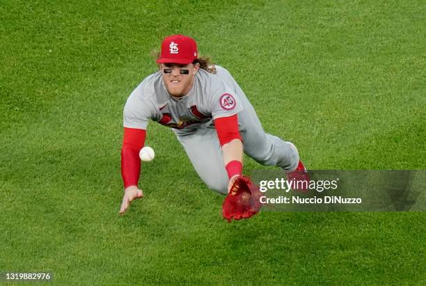 Harrison Bader of the St. Louis Cardinals is not able to make the play on a ball off the bat of Nick Madrigal of the Chicago White Sox that went for...