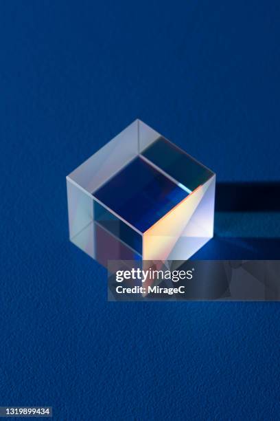 cube prism light and shadow on azure blue - プリズム　レンズ ストックフォトと画像