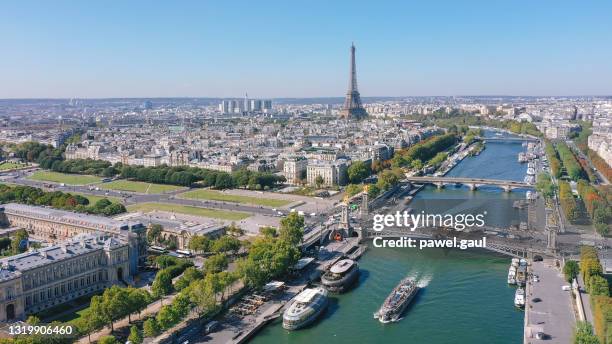 aerial view of paris with seine river and eiffel tower - seine river stock pictures, royalty-free photos & images