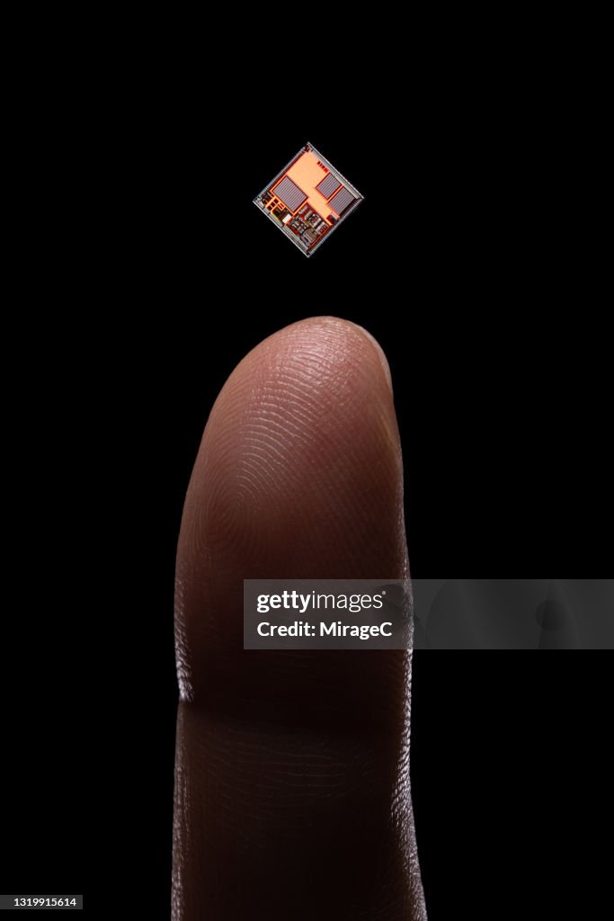 Finger Top Computer Tiny Computer Chip Levitation On Top Of Finger High-Res Stock Photo ...