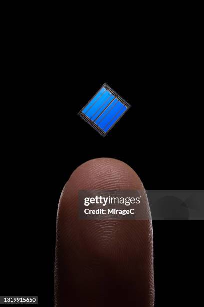 Tiny Computer Chip Tiny Microprocessor On Finger Photos and Premium High Res Pictures ...